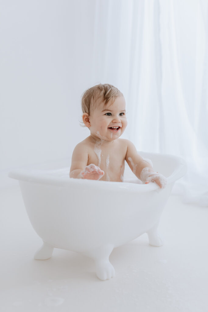 baby in bath for first birthday  photoshoot